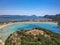 Aerial panorama view of the famous semicircular sandy beach and lagoon of Voidokilia in Messenia, Greece