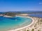 Aerial panorama view of the famous semicircular sandy beach and lagoon of Voidokilia in Messenia, Greece