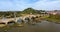 Aerial panorama view of the Guadiana River and the town of Medellin with old bridge and castle