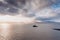 Aerial panorama view of the historic Fenit Lighthouse in Tralee Bay, beautiful clouds, sunset