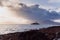 Aerial panorama view of the historic Fenit Lighthouse in Tralee Bay, beautiful clouds, sunset