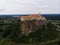 Aerial panorama view of historic old medieval castle Riegersburg on cliff top of mountain hill in Styria Austria alps
