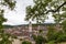 Aerial panorama view of old town cityscape of Schaffhausen from the Munot fortification in summer on a cloudy day with trees in