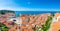 Aerial panorama view of Piran city, Slovenia. Look from tower in church. In foreground are small houses, Adriatic sea in