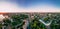 Aerial panorama view of roundabout road with circular cars in small european city at cloudy autumn day