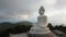 aerial panorama view scenery yellow sun with rain clouds moving..beautiful Phuket big Buddha on the top of mountain