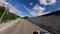 Aerial panorama view summer alpine resort infrastructure white sport car riding serpentine road