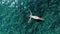 Aerial panorama on woman relaxing on clear sea water