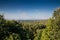 Aerial panoramal of Novi Sad, seen from a hill of Fruska Gora National park during a sunny summer afternoon surrounded by green