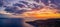 Aerial panoramic drone shot sunset over Adriatic horizon from Komiza town port on Vis Island in Croatia summer