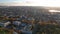 Aerial panoramic drone view of Chisinau in Moldova with roads, buildings, cars roofs of houses and autumn trees in