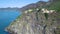 Aerial panoramic drone view from distance of Corniglia, the coast of Italy in the region of Liguria, Italy.Houses on the edge