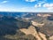 Aerial panoramic drone view of Wolgan Valley along the Wolgan River in the Lithgow Region of New South Wales, Australia.