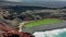 Aerial panoramic flyover of the green lake of El Golfo. Lanzarote