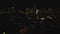 Aerial panoramic footage of buildings in night city. Lighted windows in high rise apartment or office towers. New York