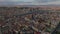 Aerial panoramic footage of city view various buildings in urban boroughs. Distant locations lit by last sun rays of day