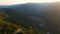 Aerial panoramic landscape of mountains at sunset.