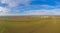 Aerial panoramic picture of a transformer station with many insulators and cables during the day