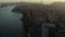 Aerial panoramic shot of cityscape against setting sun. Busy road on waterfront. Manhattan, New York City, USA