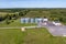 aerial panoramic view on agro-industrial complex with silos and grain drying line