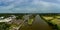 Aerial panoramic view of the bullnose entrance lock gates to Preston Marina off the River Ribble Lancashire England