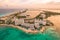 Aerial panoramic view of Cancun beach and city hotel zone in Mexico at sunset. Caribbean coast landscape of Mexican