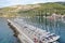 Aerial panoramic view of city Komiza - the one of numerous port towns in Croatia, is a lot of moored sailboats of a