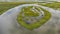 Aerial panoramic view on the coastal wetland with rain cloudedsky on background