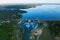 Aerial panoramic view of concrete Dam at reservoir with flowing water, hydroelectricity power station, drone shot