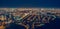 Aerial panoramic view, flight on drone above night city Voronezh with illuminated roads and high-rise buildings