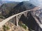 Aerial panoramic view of historic Bixby Creek Bridge along world famous Pacific Coast Highway 1 in summer sunny day , Monterey