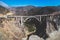 Aerial panoramic view of historic Bixby Creek Bridge along world famous Pacific Coast Highway 1 in summer sunny day , Monterey