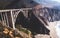 Aerial panoramic view of historic Bixby Creek Bridge along world famous Pacific Coast Highway 1 in summer sunny day , Monterey