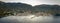 Aerial panoramic view of Komiza town coastline on Vis island before sunrise in Croatia