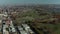 Aerial panoramic view of large city. Highway interchange near large Calvary Cemetery. Tilt down on rows of tombstones in