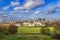 Aerial panoramic view of London`s National Maritime Museum, the Royal Naval College Chapel and skyscrapers of Canary Wharf from