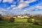 Aerial panoramic view of London`s National Maritime Museum, the Royal Naval College Chapel and skyscrapers of Canary Wharf from