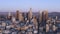 Aerial panoramic view of Los Angeles downtown during sunrise in the summer