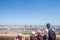 Aerial panoramic view of Lyon with children tourists pointing at the skyline & the Incity tower & Le Crayon during sunny afternoon