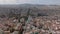 Aerial panoramic view of metropolis, fly above historic buildings and long straight street in city centre. Barcelona