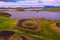 Aerial panoramic view of Myvatn, Iceland at epic sunset. Volcanic Craters In Green Plaints and link clouds and sky