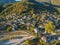 Aerial panoramic view over the picturesque village Papigo in Epirus, Greece at sunset. Scenic aerial view of traditional Greek