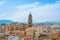 Aerial panoramic view over the roofs to a tower of Malaga Cathedral from the walls and towers of Castillo Gibralfaro (Castle of G
