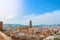 Aerial panoramic view over the roofs to a tower of Malaga Cathedral from the walls and towers of Castillo Gibralfaro (Castle of G