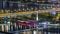 Aerial panoramic view over Vienna city with skyscrapers, historic buildings and a riverside promenade night time lapse