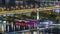 Aerial panoramic view over Vienna city with skyscrapers, historic buildings and a riverside promenade night timelapse in