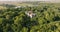 aerial panoramic view overlooking the old abandoned palace or historic buildings in forest