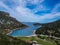 Aerial panoramic view of the picturesque old harbor Gerakas in northern Alonnisos, Greece. Beautiful scenery with rocky formation
