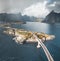 Aerial panoramic view of Reine traditional fishing village in the Lofoten archipelago in northen Norway with blue sea