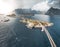 Aerial panoramic view of Reine traditional fishing village in the Lofoten archipelago in northen Norway with blue sea